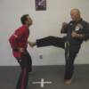 Huk kicking Dave Miller for his promotion to 4th Degree Black.