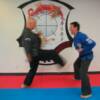 Huk kicking Steve Casamento for his promotion to 4th Degree Black.